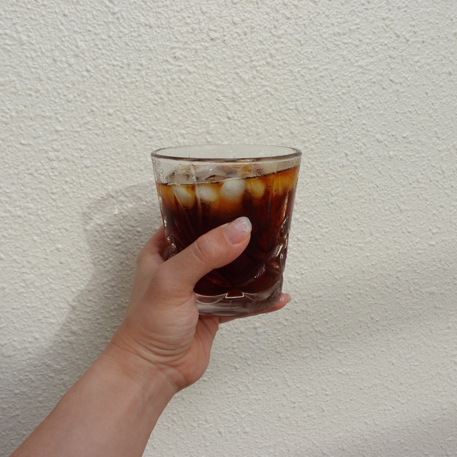 a cup of fresh brewed iced pour-over in a crystal glass cup